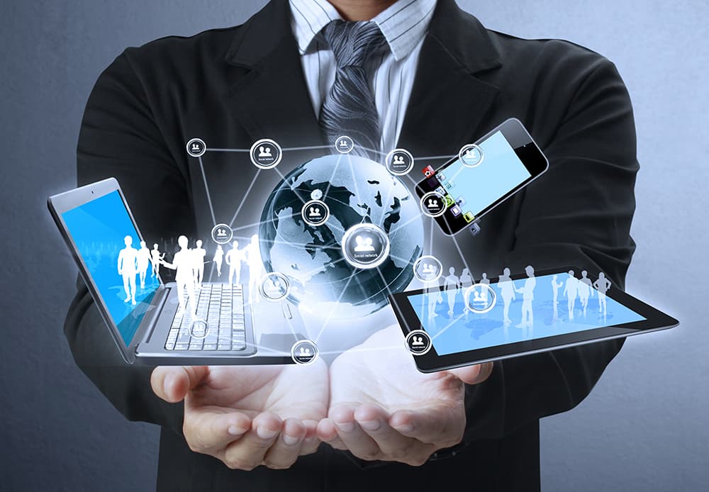 Man holding laptop globe showing mobile payment processing